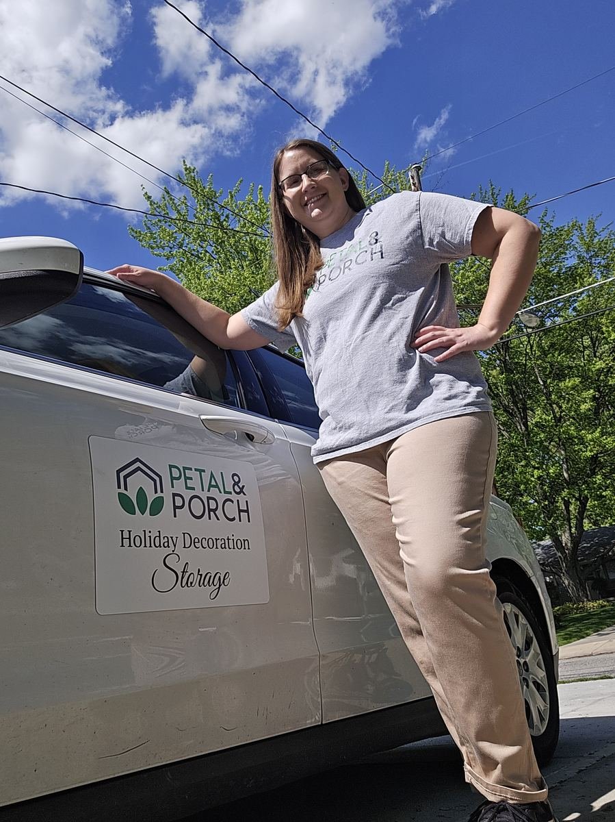 Stephanie Novak, founder of Petal & Porch, standing next to her branded car